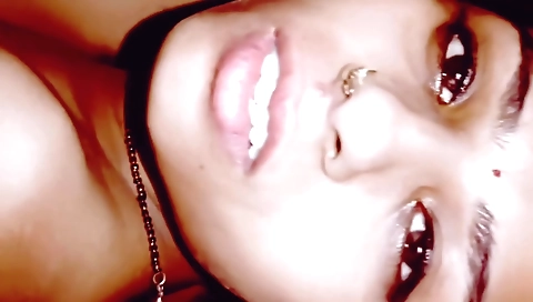 A sexy brunette in a tight black dress with a nice body