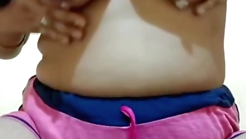 Sexy brunette wears sexy dress and moans on webcam