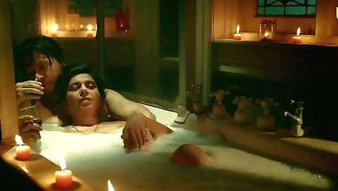 Sexy brunette with a cute face takes off her clothes