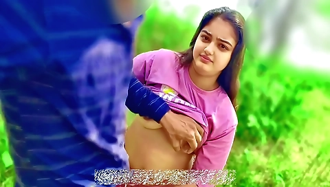 Indian girl in a dress riding her boyfriend in the jungle