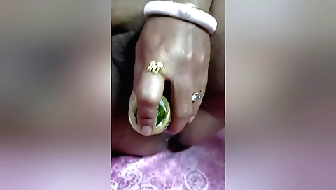Indian amateur girl masturbates with a cucumber toy
