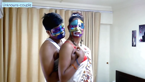 Indian girl in a red saree is going wild in a studio