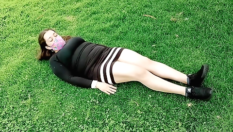 Curly girl with a big ass is on the floor in front of the camera