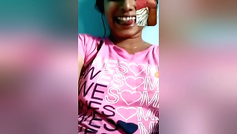 A sexy brunette in a nice green outfit shows off her body