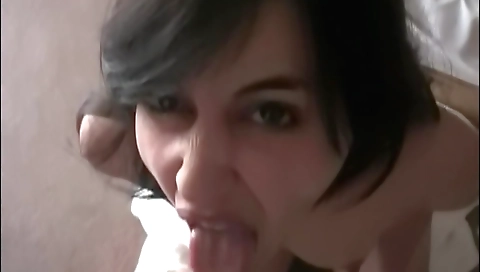 Brunette amateur looks cute while sucking cock in hotel