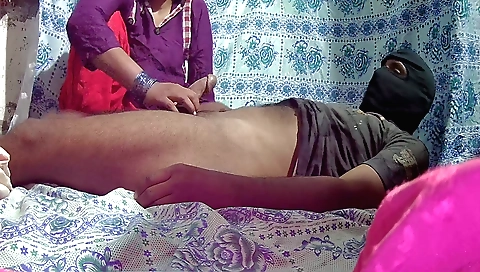 Blonde and her man sharing a sex handjob on the bed