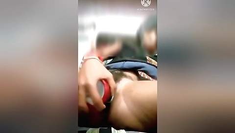 Hairy brunette with a shaved pussy plays with a toy