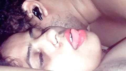 Indian brunette standing on her knees in a tight bikini