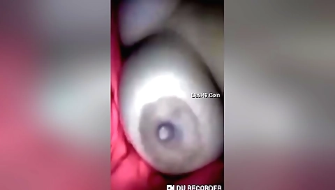 Amateur brunette girl shows her boobs in webcam video