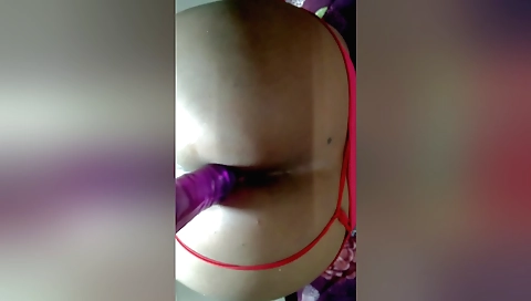 Busty indian slut with a big ass takes a large dildo in her ass