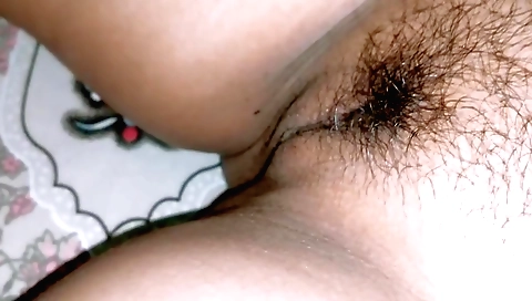 Indian teen is showing her hairy pussy in the bedroom