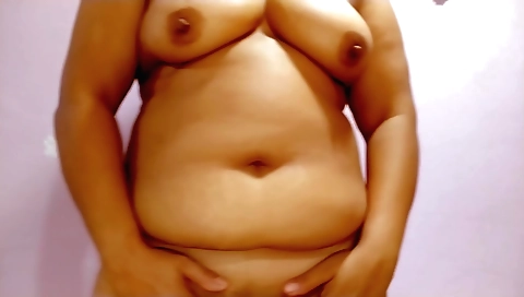 Indian brunette with big tits in bed doing something sexy